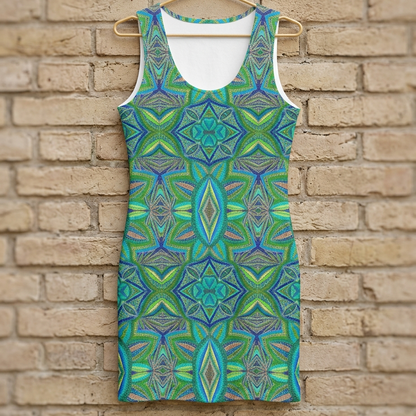 Green and blue patterned dress on a hanger against a brick wall
